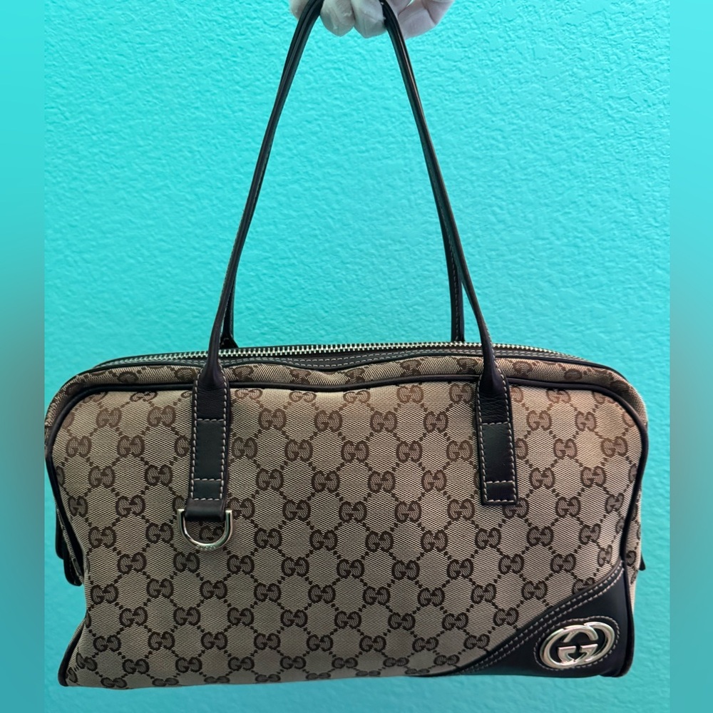 Gucci Medium Shoulder Zip Top Bag in GG canvas and leather trim, three pockets